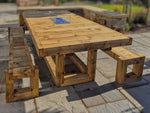 8ft x 4ft Solid wood dining table with matching benches and central firepit